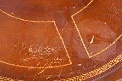 Round carved mahogany 2 drawers center table with leather top; 55-12235