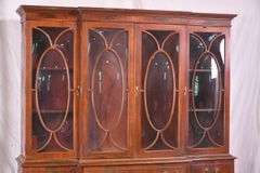 Crotch mahogany 2 part bubble glass breakfront; 74-12886
