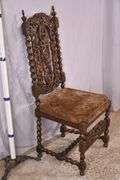 Heavily carved accent chair with barley twist legs, columns, and stretchers; 192-3100