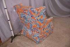 Upholstered wingback armchair with dragon pattern fabric; 336-4581