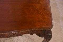 Carved mahogany dining table with ball in claw feet; 74-12884A