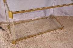 Lucite and gold metal console table with glass top and shelf; 74-12880