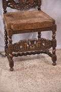 Heavily carved accent chair with barley twist legs, columns, and stretchers; 192-3100