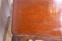 Carved mahogany dining table with ball in claw feet; 74-12884A