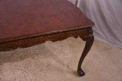 Carved mahogany dining table with ball in claw feet; 74-12884A