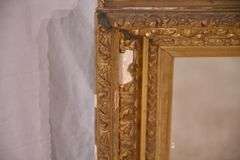 Early mirror with ornate gold frame; 1037-1166