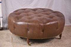 Round tufted leather ottoman; 55-12251