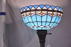 Tall metal floor lamp with blue stained glass shade; 1116-731