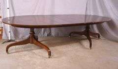 Oval mahogany double pedestal dining table with 3 leaves; 18301-001