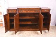 Mahogany credenza with leather top and mirrored doors; 21-2704