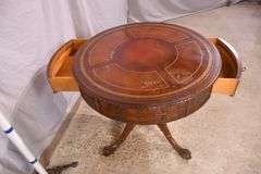 Round carved mahogany 2 drawers center table with leather top; 55-12235