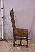 Heavily carved accent chair with barley twist legs, columns, and stretchers; 192-3100