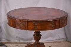 Round carved mahogany 2 drawers center table with leather top; 55-12235