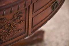 Round carved mahogany 2 drawers center table with leather top; 55-12235