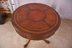 Round carved mahogany 2 drawers center table with leather top; 55-12235