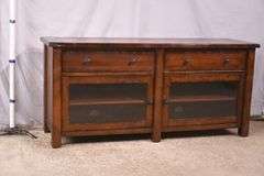Pottery Barn distressed entertainment credenza with 2 drop-front drawers and 2 glass doors; 55-12263