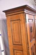 Early inlaid 2 door armoire with black trim; 55-12302