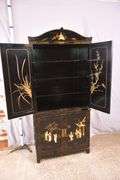 Black and gold Oriental decorated 2 part armoire with fitted interior; 55-12157