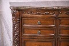 Ashley Furniture Co. large carved serpentine front 9 drawer triple dresser with marble tile top; 1153-098