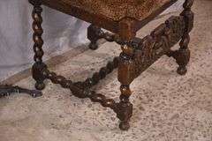 Heavily carved accent chair with barley twist legs, columns, and stretchers; 192-3100