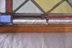 Stained glass panel with oak frame; 9485-118