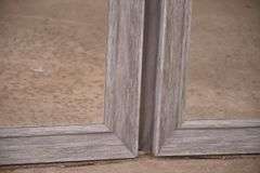 Pair of mirrors with distressed light gray frames; 336-4567