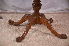 Round carved mahogany 2 drawers center table with leather top; 55-12235