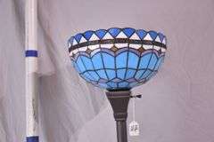 Tall metal floor lamp with blue stained glass shade; 1116-731