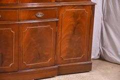 Crotch mahogany 2 part bowfront breakfront; 55-12189