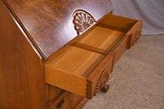 Burl walnut slant-front desk with ball in claw feet; 55-12174