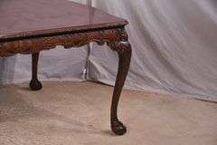 Carved mahogany dining table with ball in claw feet; 74-12884A