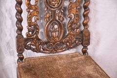 Heavily carved accent chair with barley twist legs, columns, and stretchers; 192-3100