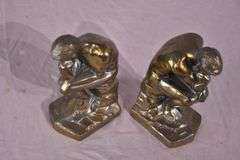 Pair of gold metal Thinking Man bookends; 1037-1159