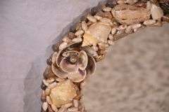 Small round mirror with seashell frame; 55-12218G
