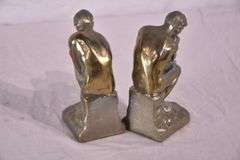 Pair of gold metal Thinking Man bookends; 1037-1159