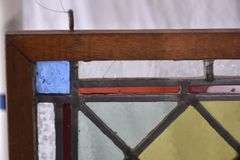 Stained glass panel with oak frame; 9485-118