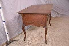 Carved oak 4 drawer writing desk; 55-12158