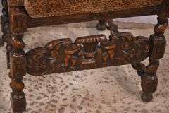 Heavily carved accent chair with barley twist legs, columns, and stretchers; 192-3100