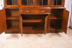 Crotch mahogany 2 part bowfront breakfront; 55-12189