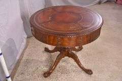Round carved mahogany 2 drawers center table with leather top; 55-12235
