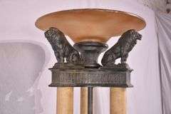 Large 3 column floor lamp with amber shade and lion figures on top; 74-12849