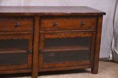Pottery Barn distressed entertainment credenza with 2 drop-front drawers and 2 glass doors; 55-12263