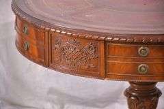 Round carved mahogany 2 drawers center table with leather top; 55-12235