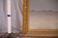Early mirror with ornate gold frame; 1037-1166