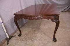 Carved mahogany dining table with ball in claw feet; 74-12884A