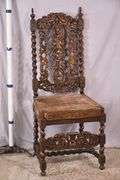 Heavily carved accent chair with barley twist legs, columns, and stretchers; 192-3100