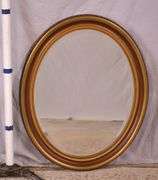 Oval beveled mirror with gold trimmed frame; 18305-001