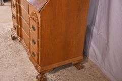 Burl walnut slant-front desk with ball in claw feet; 55-12174