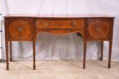Inlaid crotch mahogany serpentine front sideboard; 74-12887