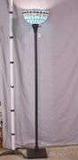 Tall metal floor lamp with blue stained glass shade; 1116-731